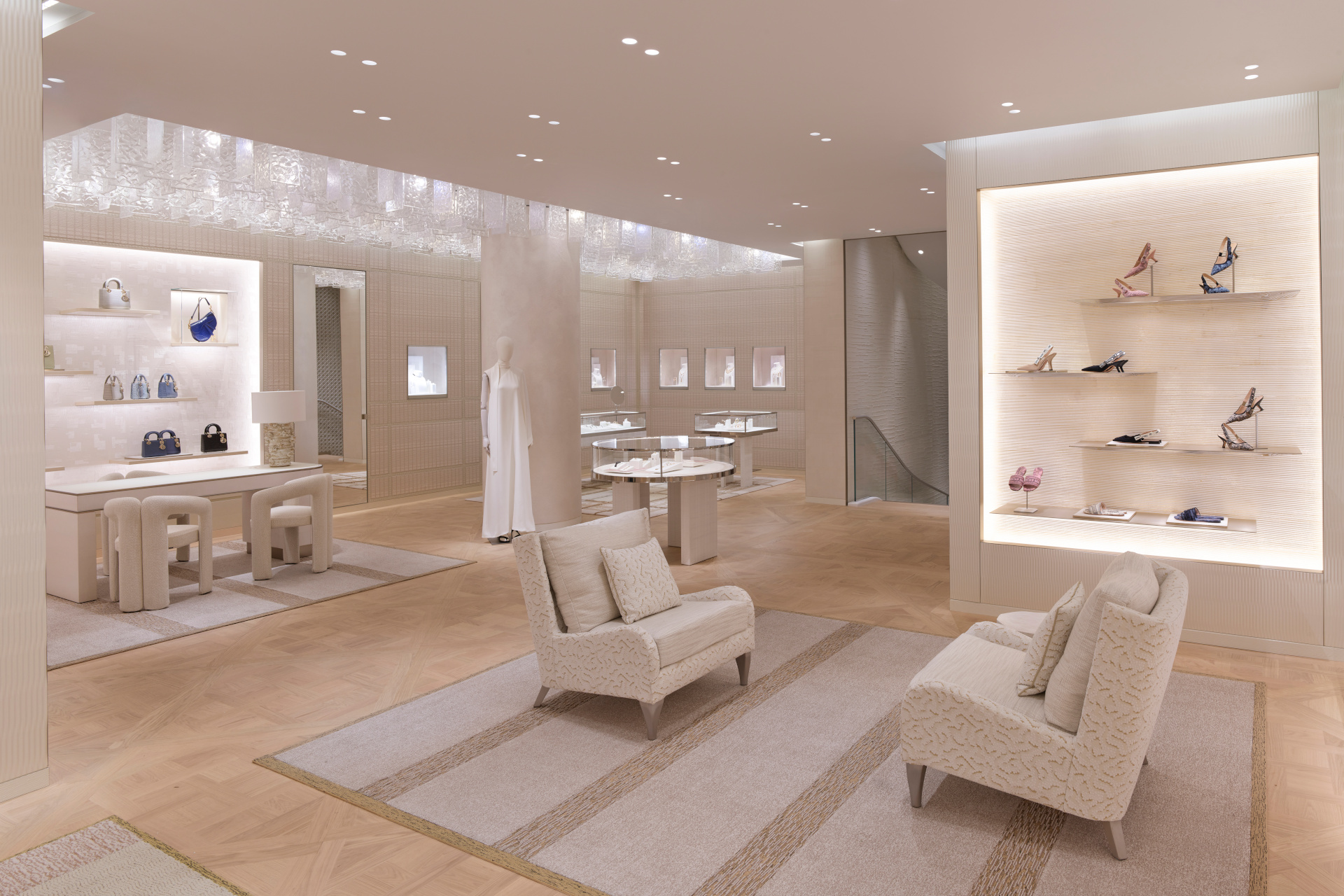 Cream shop set-up with armchairs and accessories