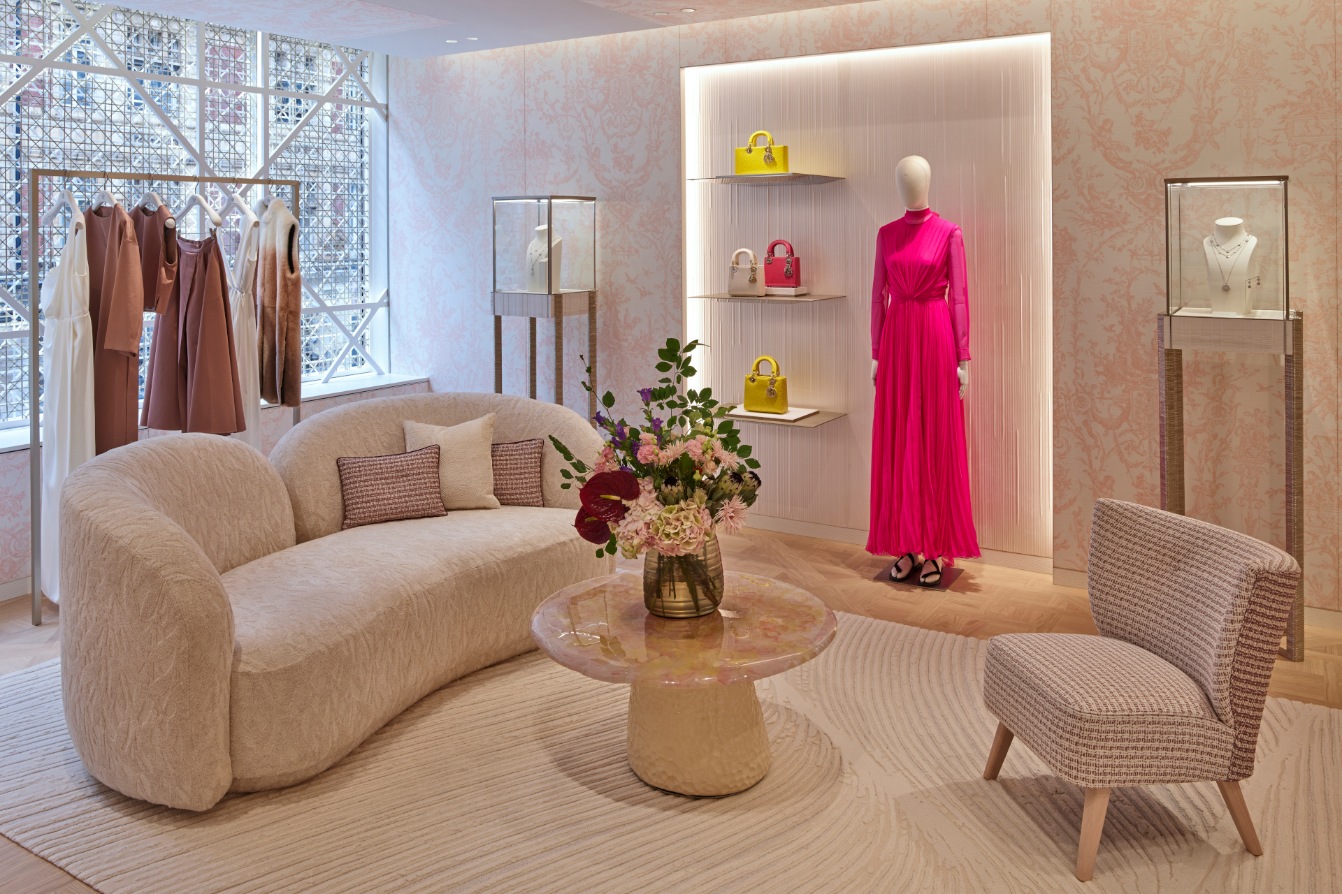 Sitting area with clothing and mannequins on display