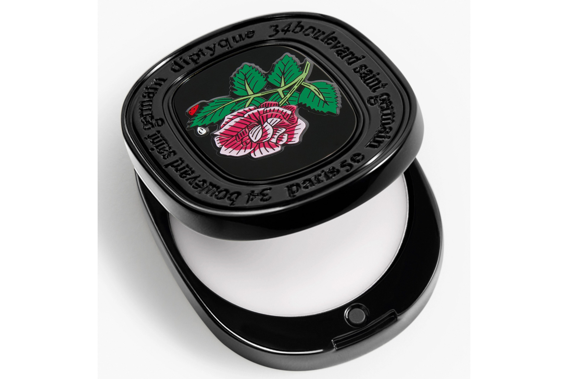 Solid refillable perfume with Diptyque logo and a rose on the front.