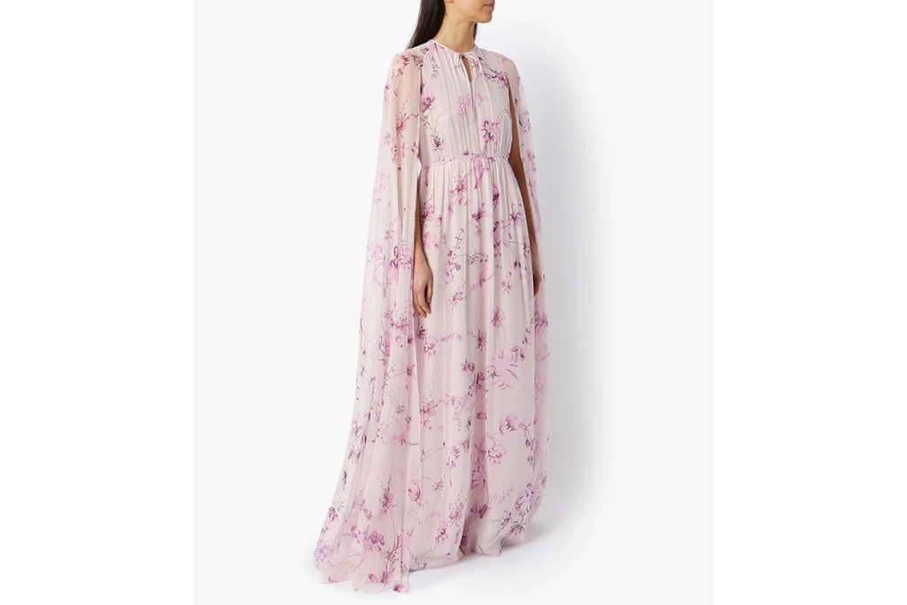 Woman in floral pink gown and cape