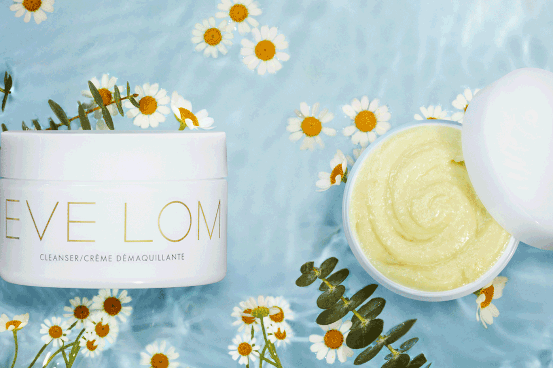 Eve Lom skincare against blue daisy background