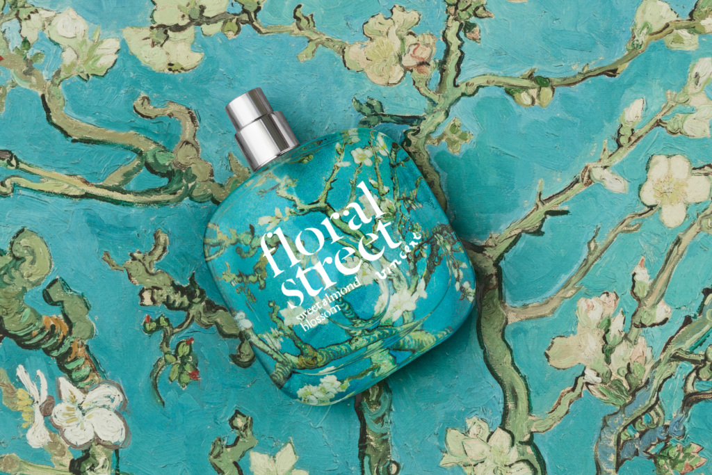Clear perfume bottle on painted blue floral background - British perfume brands