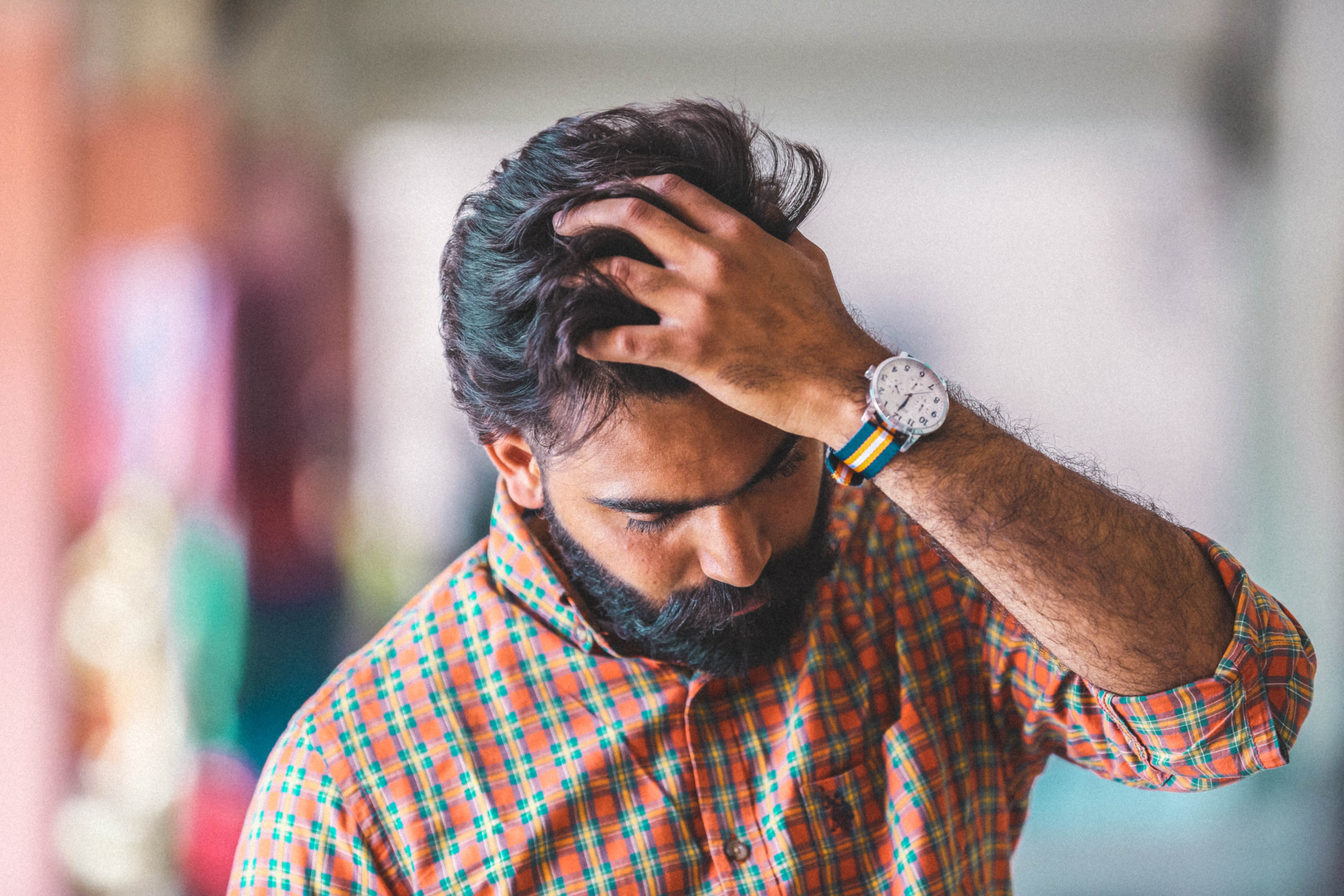 Man pushing his hair back