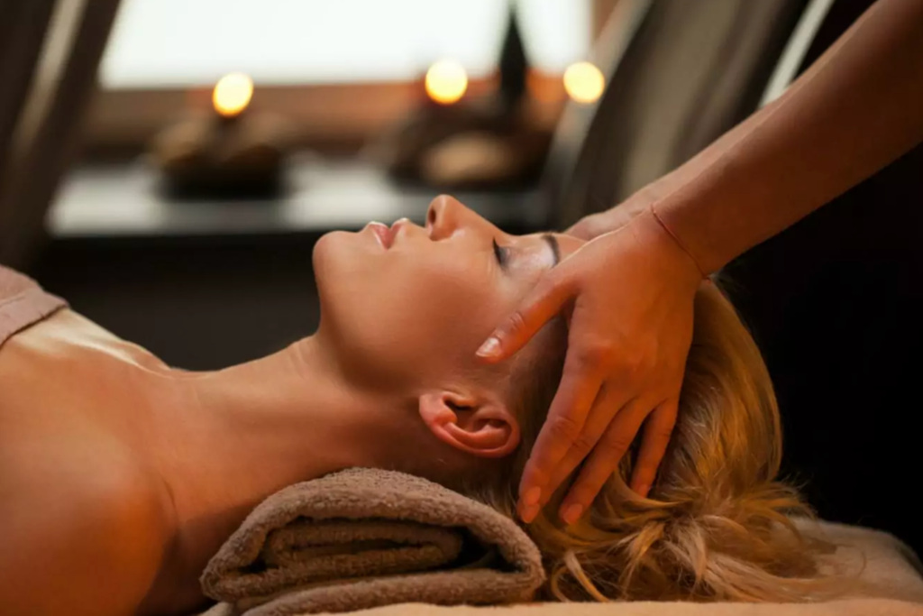 Woman receiving head massage