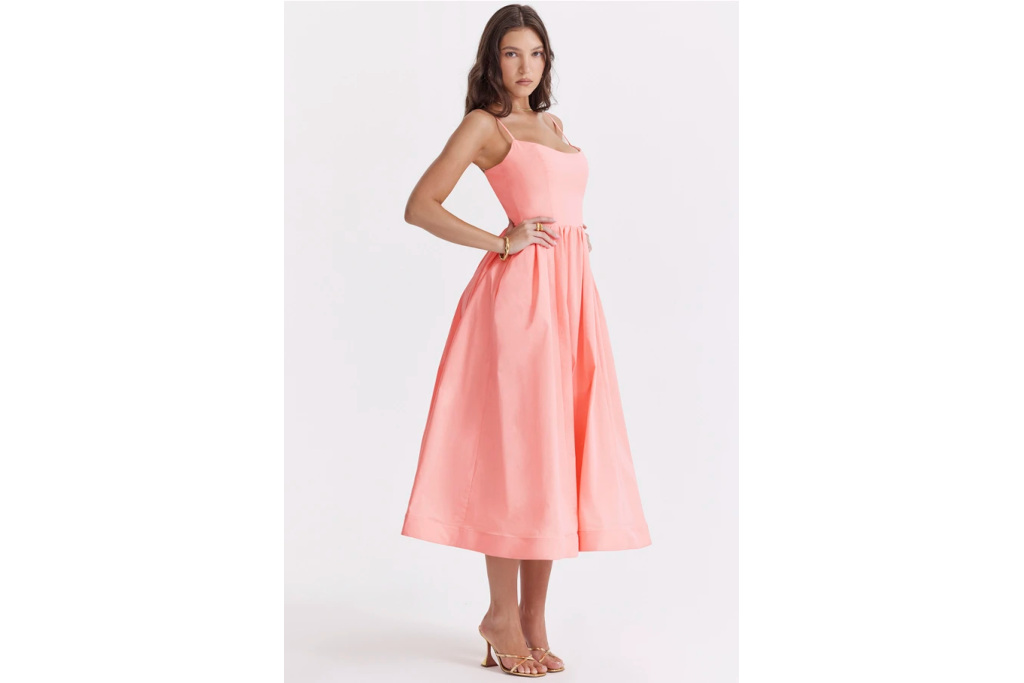 Woman in mid-length pink dress