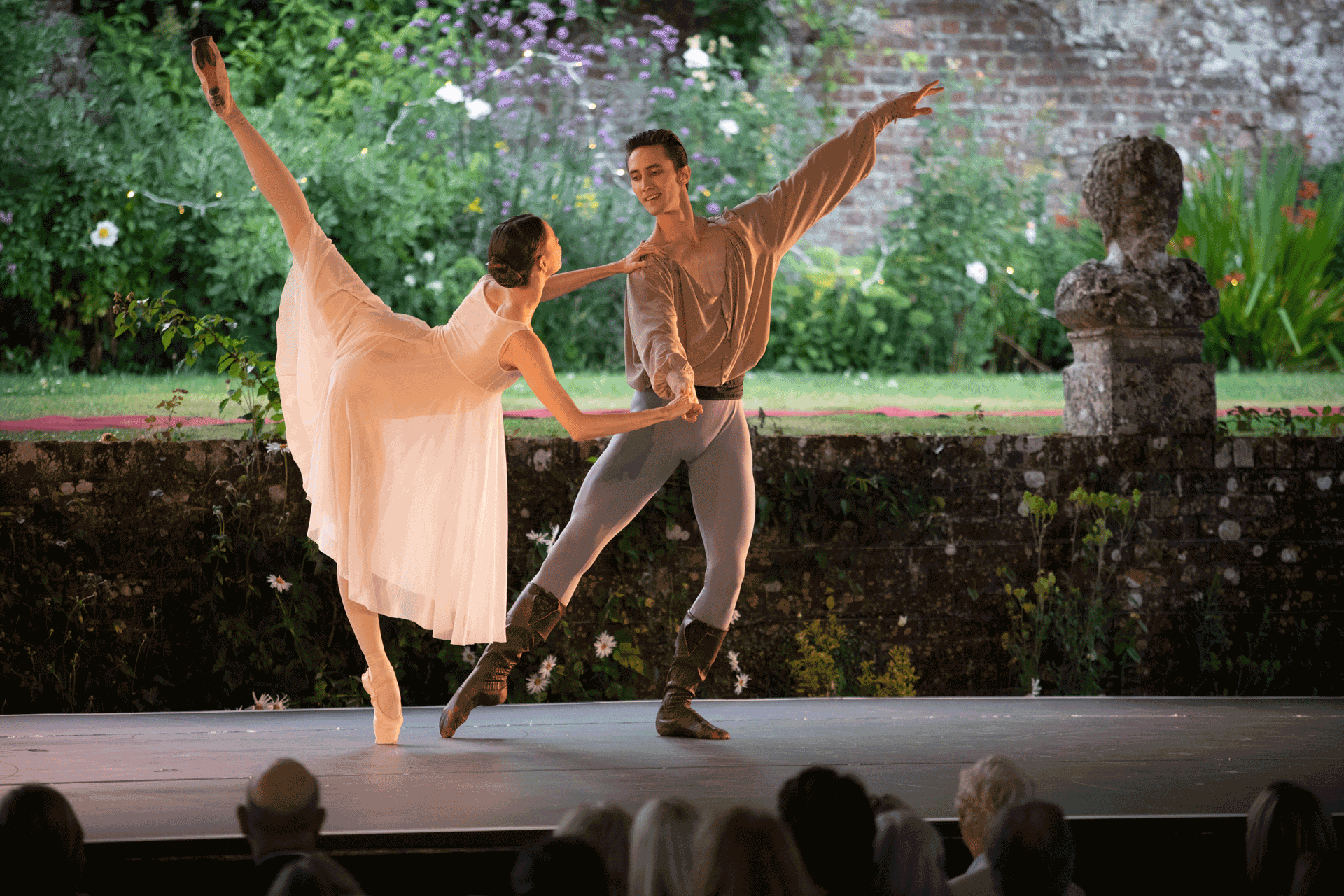Ballet dancers on the outdoor stage at Hatch House in Wiltshire.