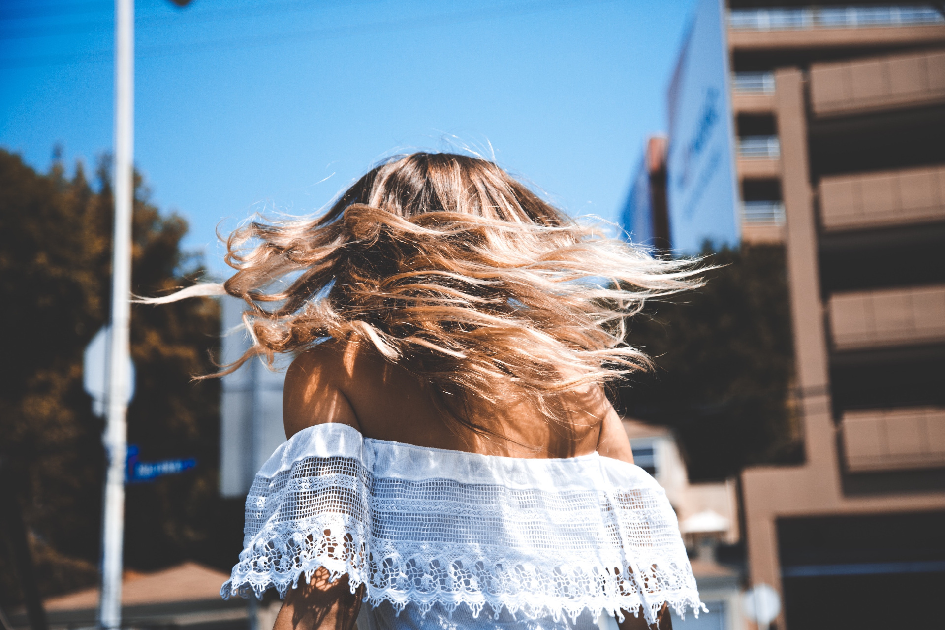 Woman shaking out blonde hair