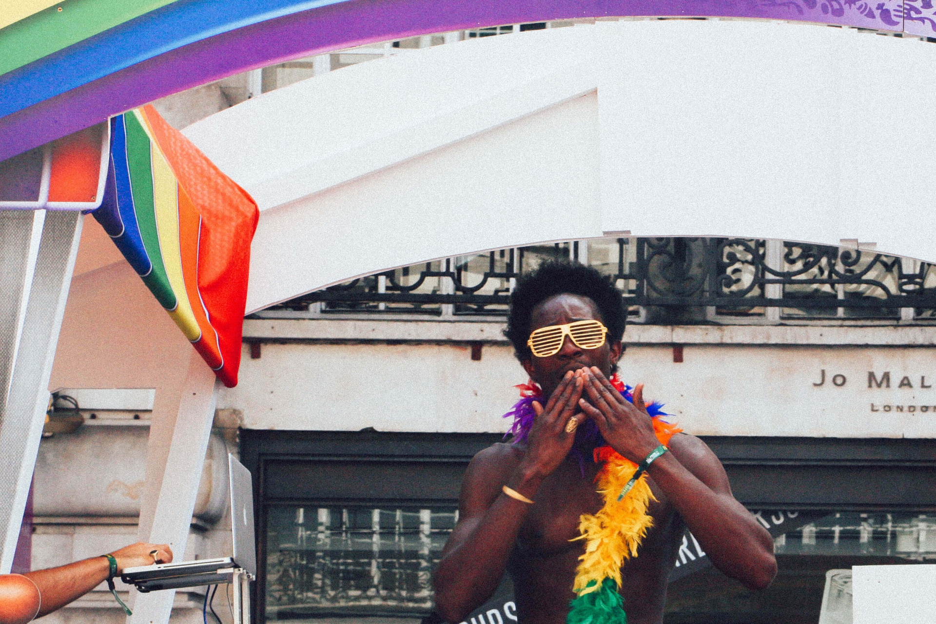 Man in rainbow outfit at Pride