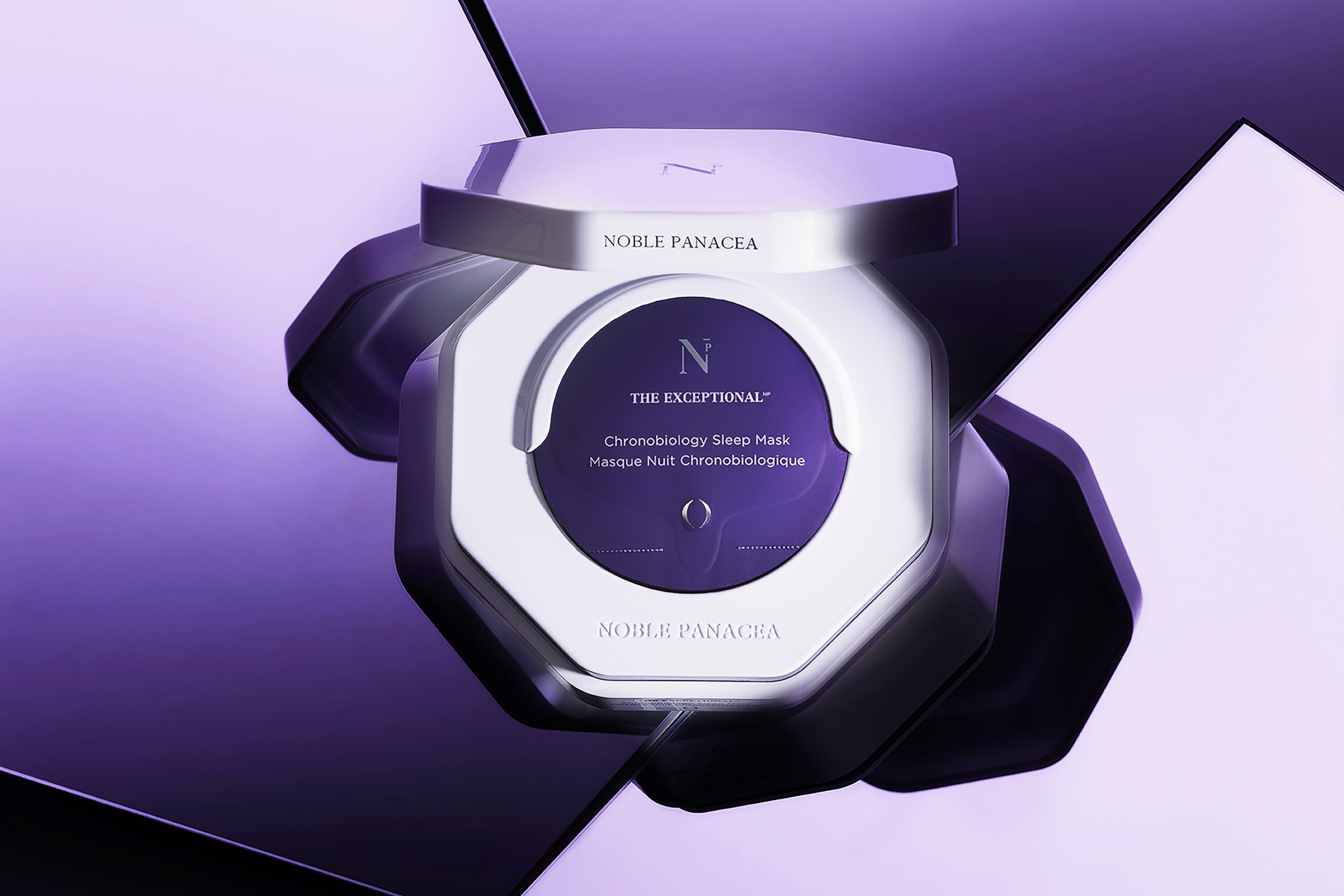 White compact with face mask sachets inside on purple background