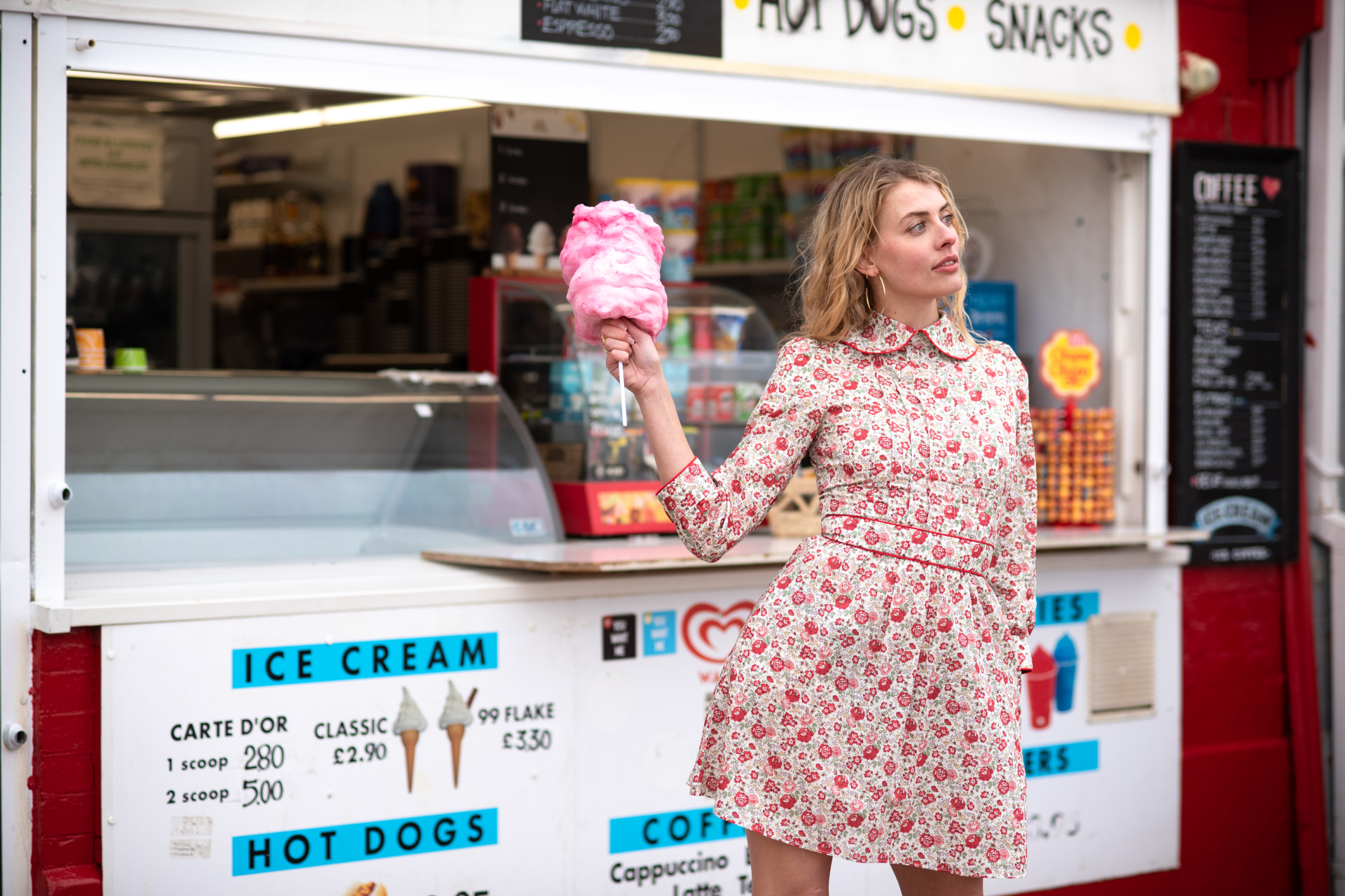 Woman in floral dress with candy floss