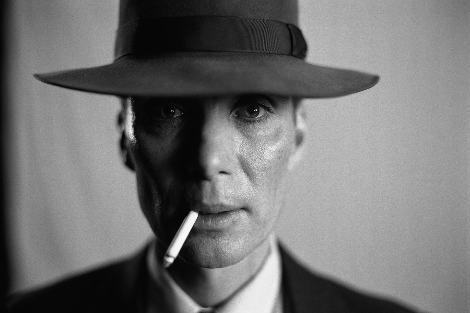 Cillian Murphy as J. Robert Oppenheimer in OPPENHEIMER, written and directed by Christopher Nolan. This still is an 11K scan of a 70mm B&W IMAX film frame.