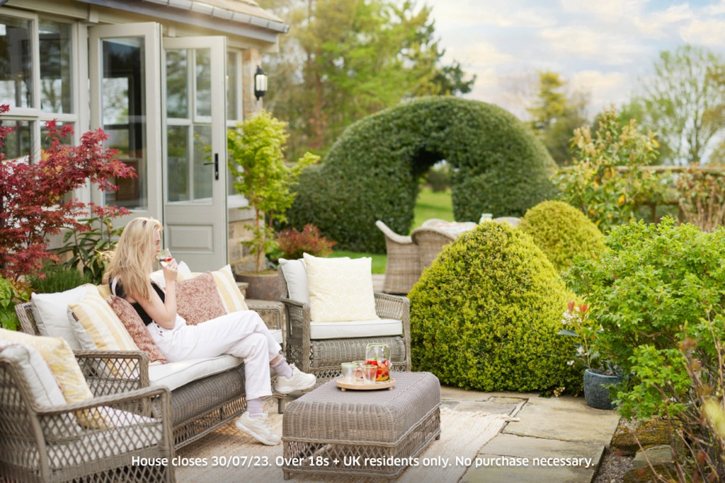 Woman sat in garden