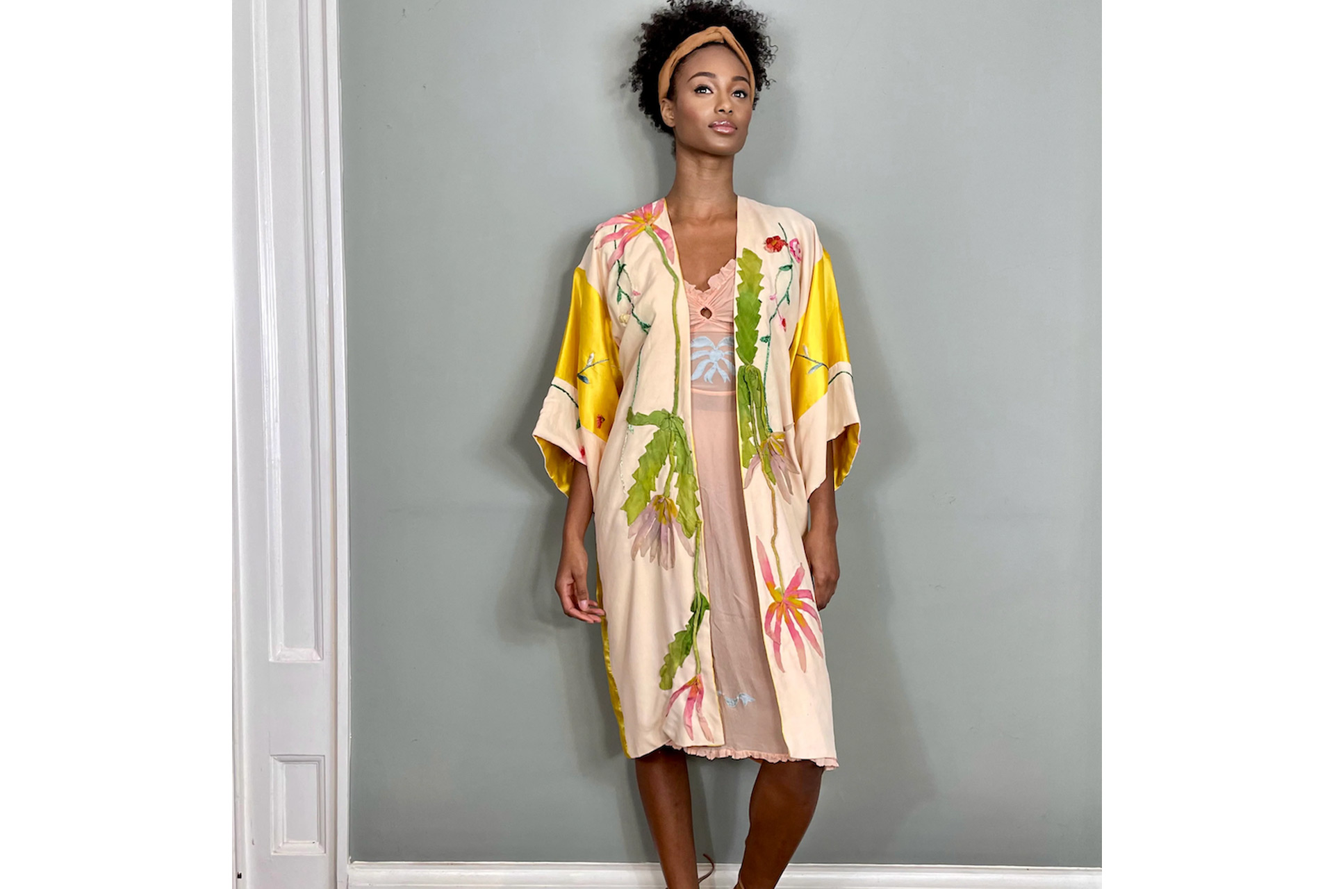 Yellow and pink silk kimono with embroidered flowers.