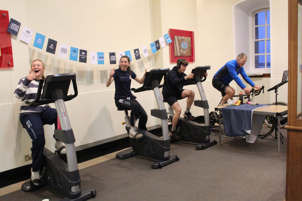 Pupils and staff participating in the cycling challenge on Giving Day