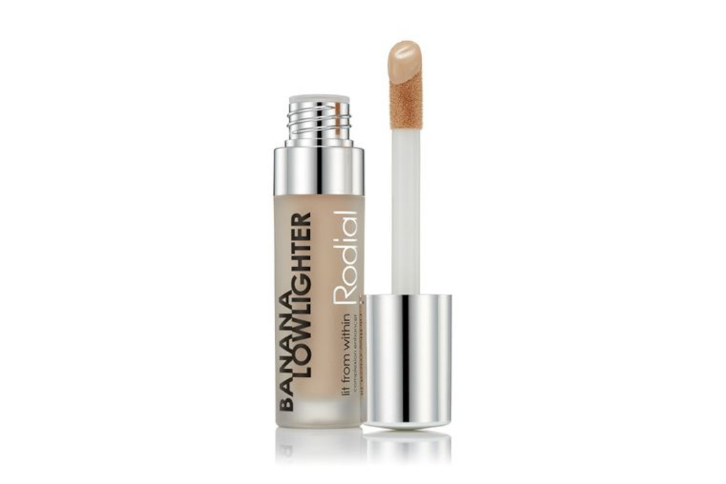 Bottle of concealer with applicator