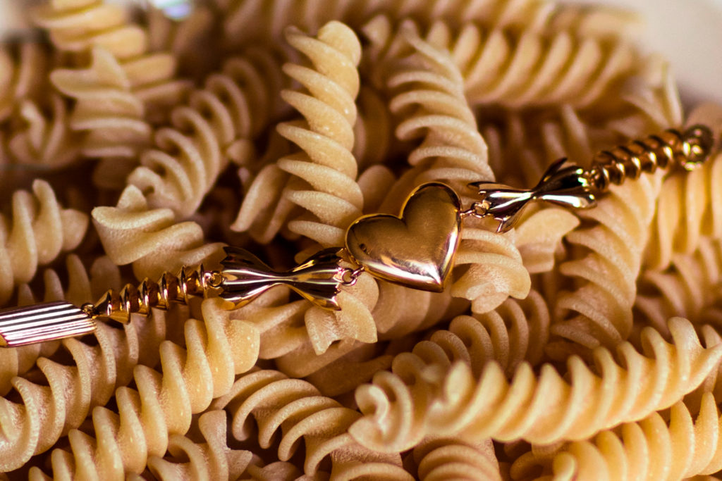 Gold bracelet on pasta