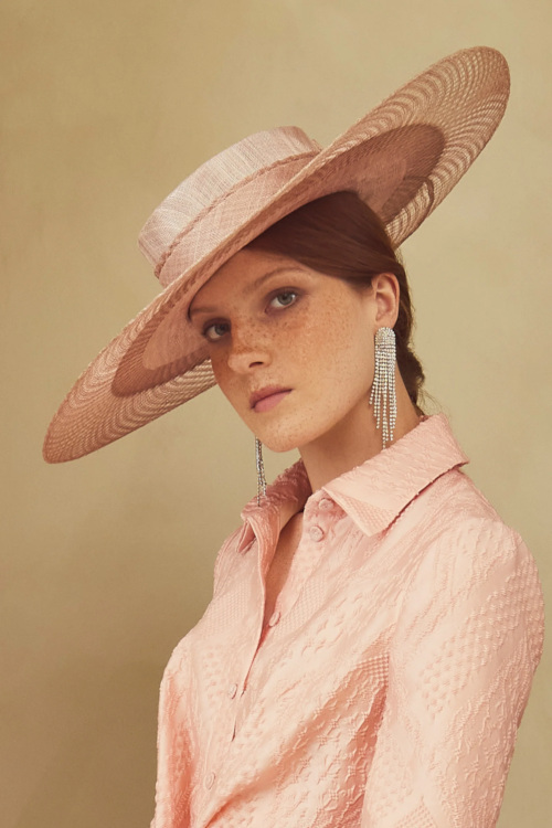 Woman wearing pink hat and top