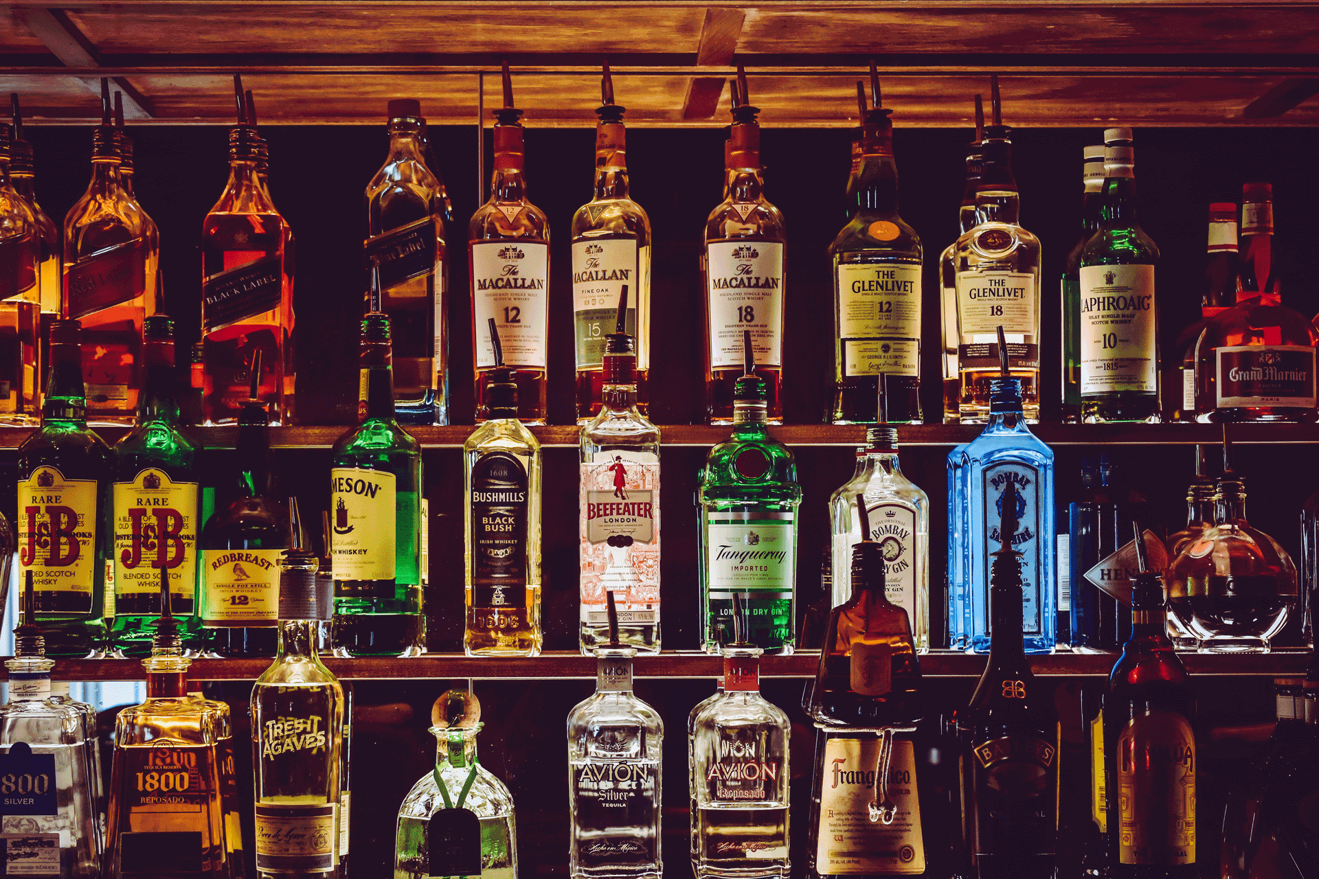 Rows of spirits at a bar.