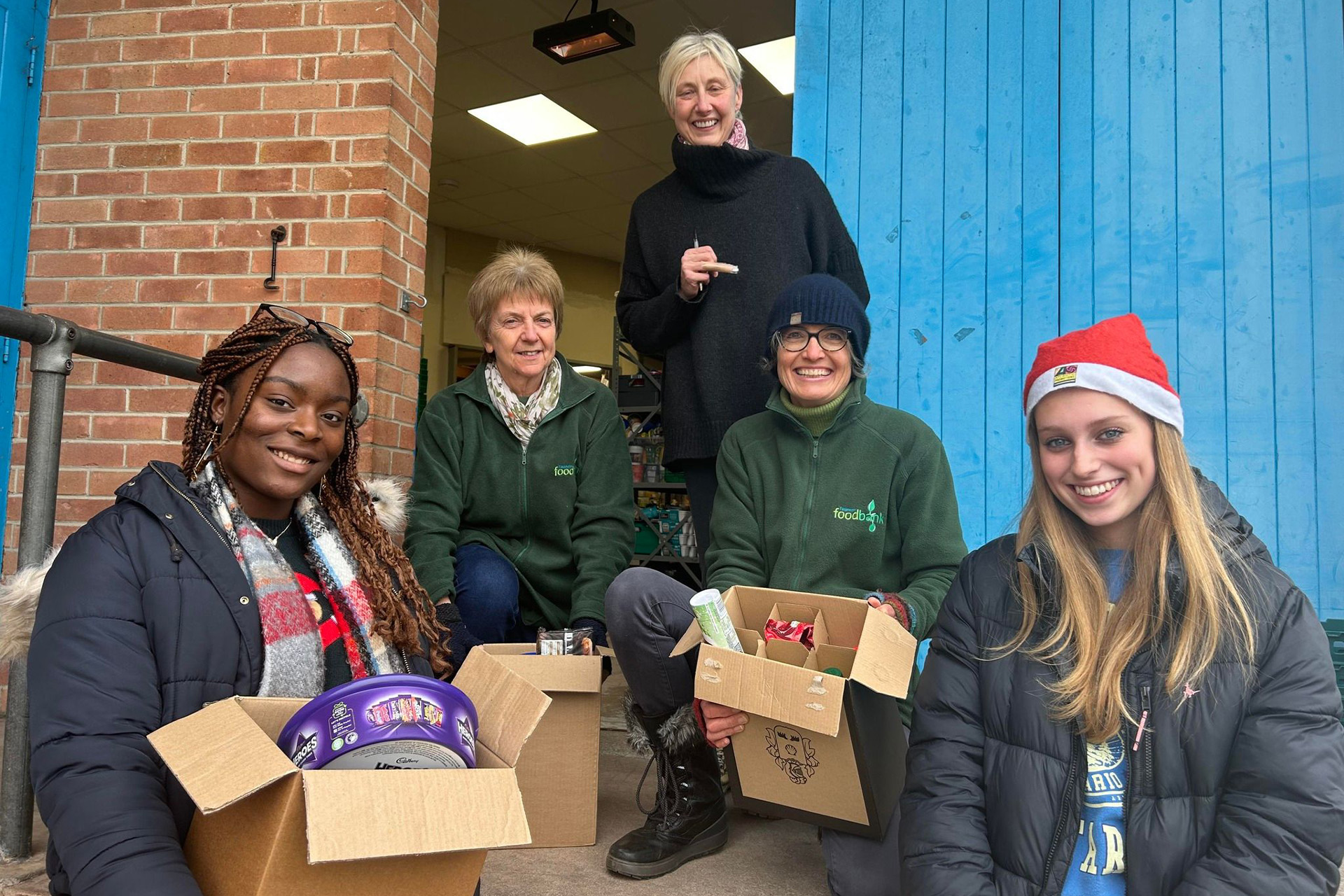 Queen's College Deliver Christmas Treats to Local Foodbank