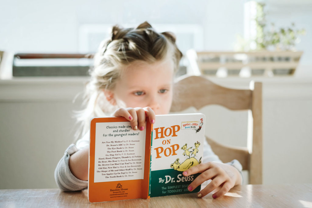 Child reading poetry (Image: Unsplash)