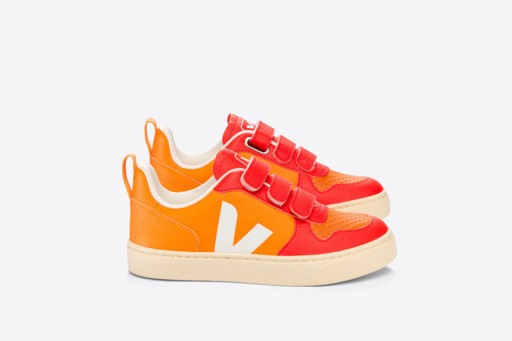 The red and orange kids trainers from VEJA x The Animal Observatory