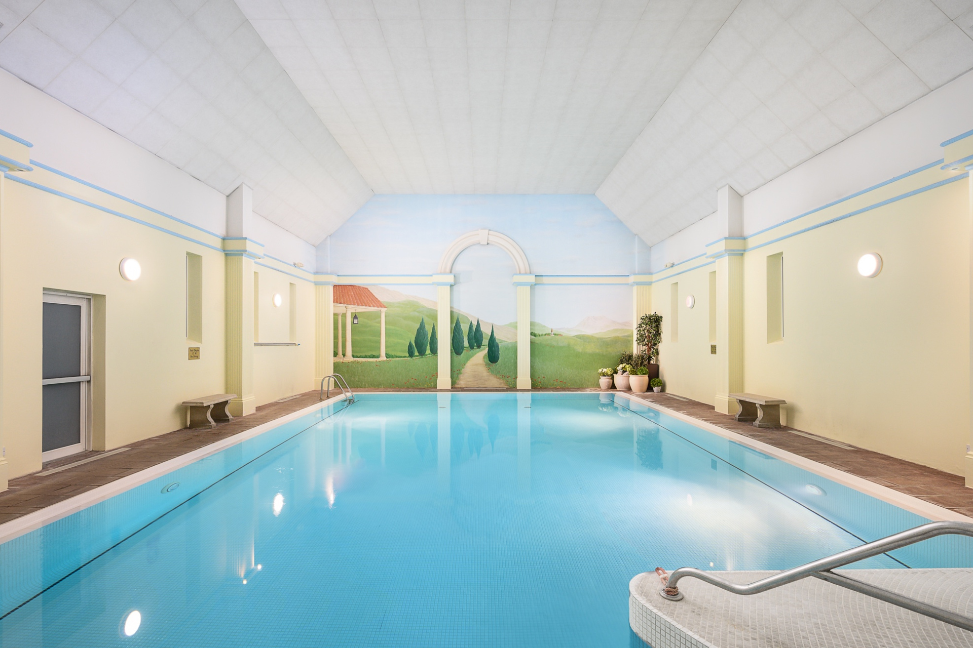 Indoor pool with painted walls