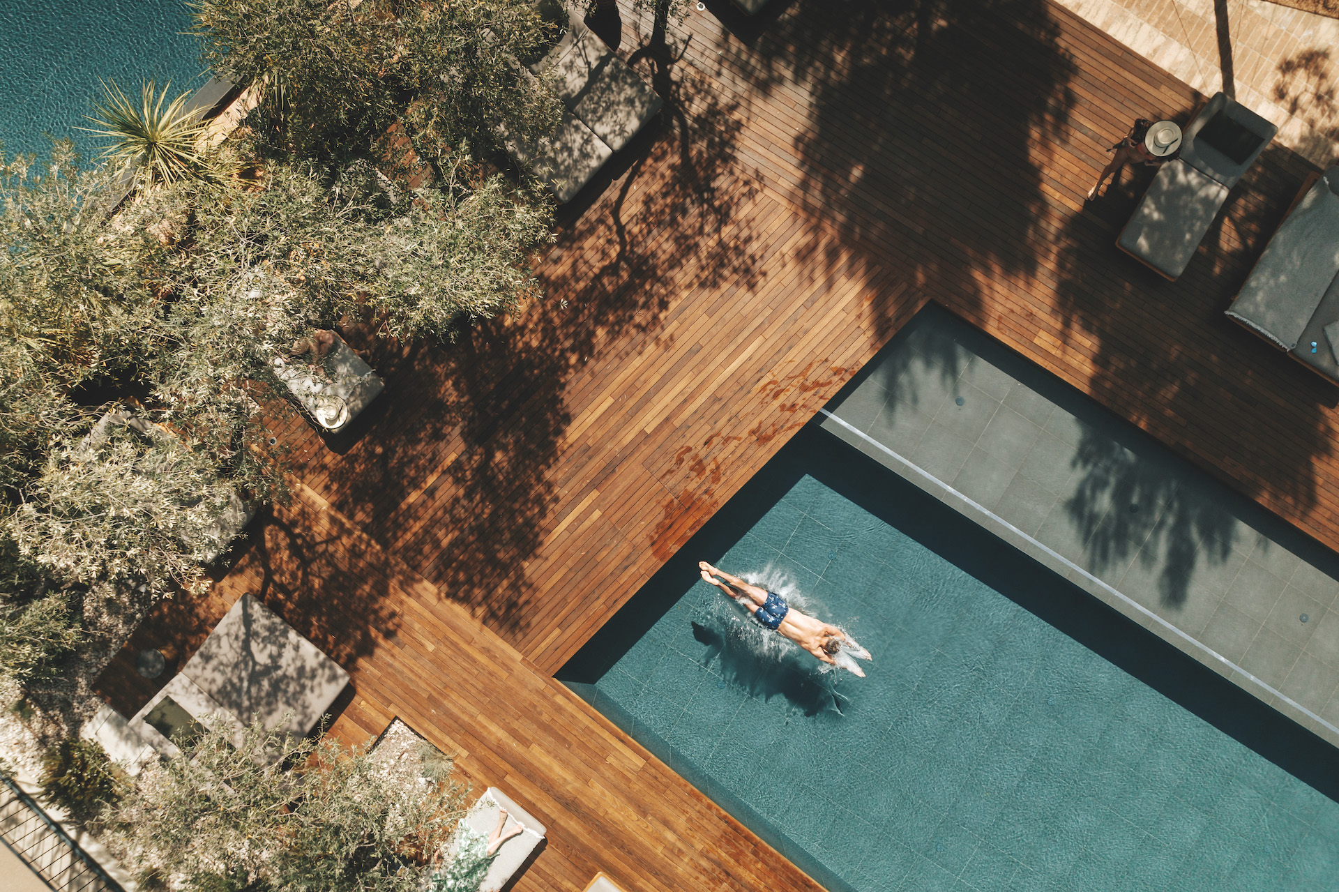 Man swims in pool at Maslina Resort