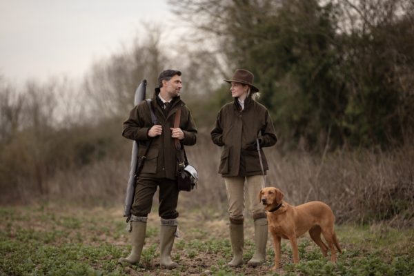 Farlows man woman and dog in field - British Sporting Brands