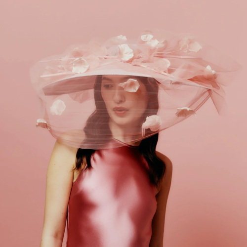 Woman in pink outfit | british hat brands