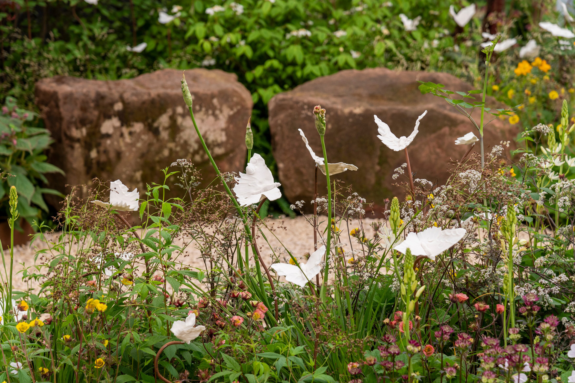 The Talitha Arts Garden. Designed by Joe and Laura Carey. Sponsored by Talitha Arts and Project Giving Back. All About Plants. RHS Chelsea Flower Show 2023. Stand no 20.