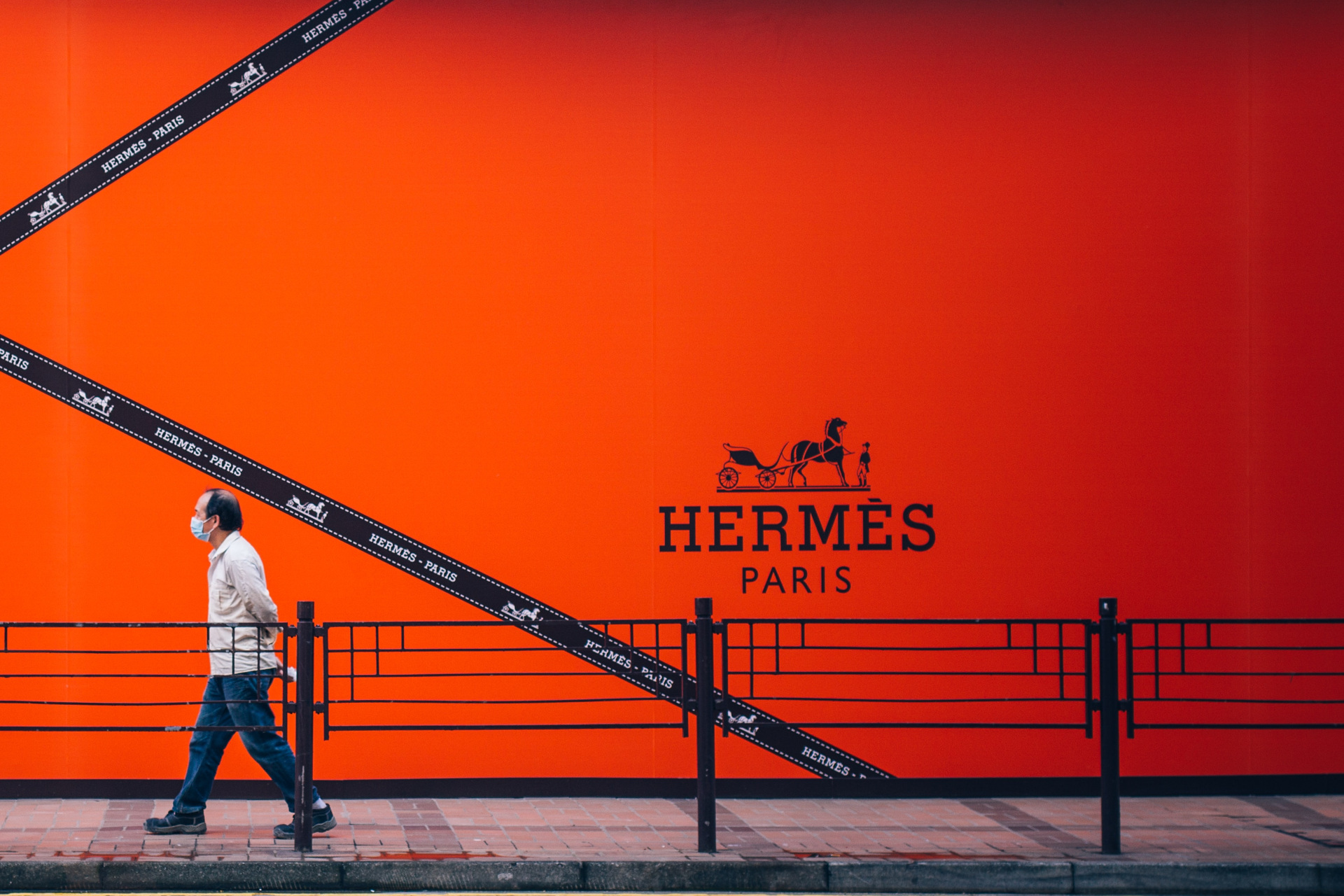 Orange Hermes poster on building