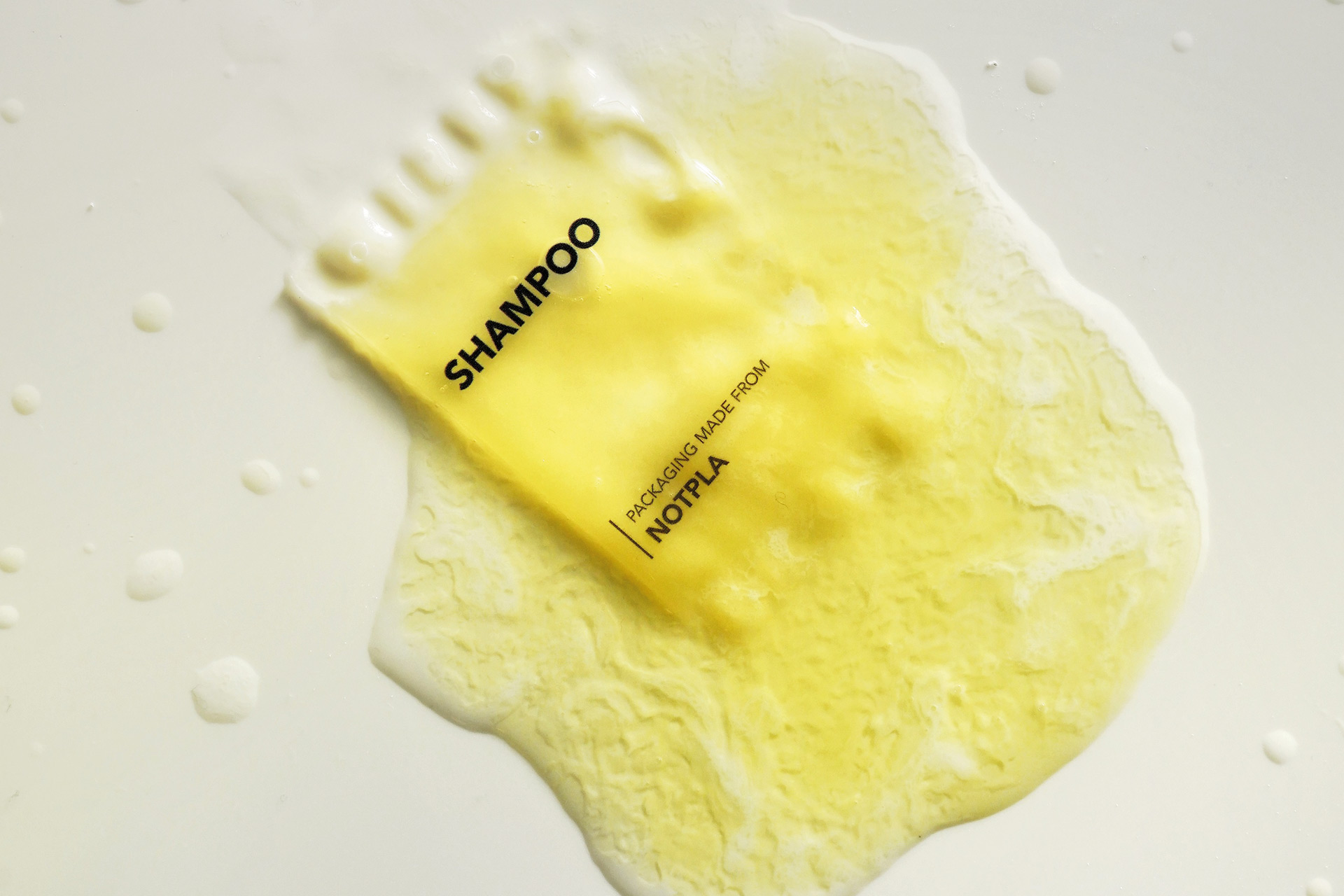 Biodegradable seaweed packet of yellow shampoo