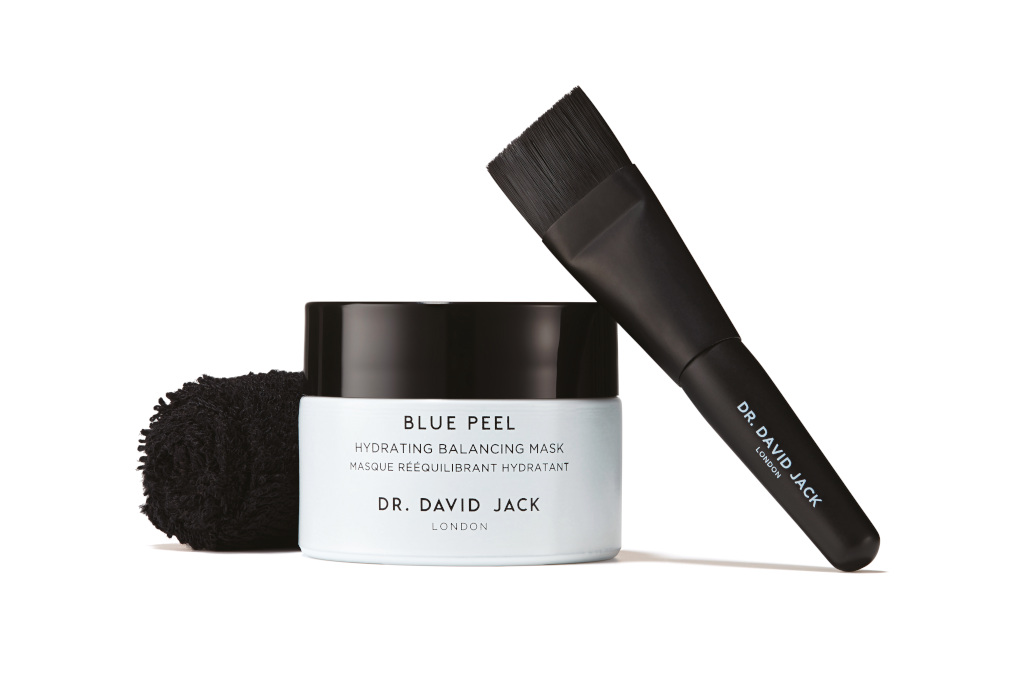 White tub with black lid and brush