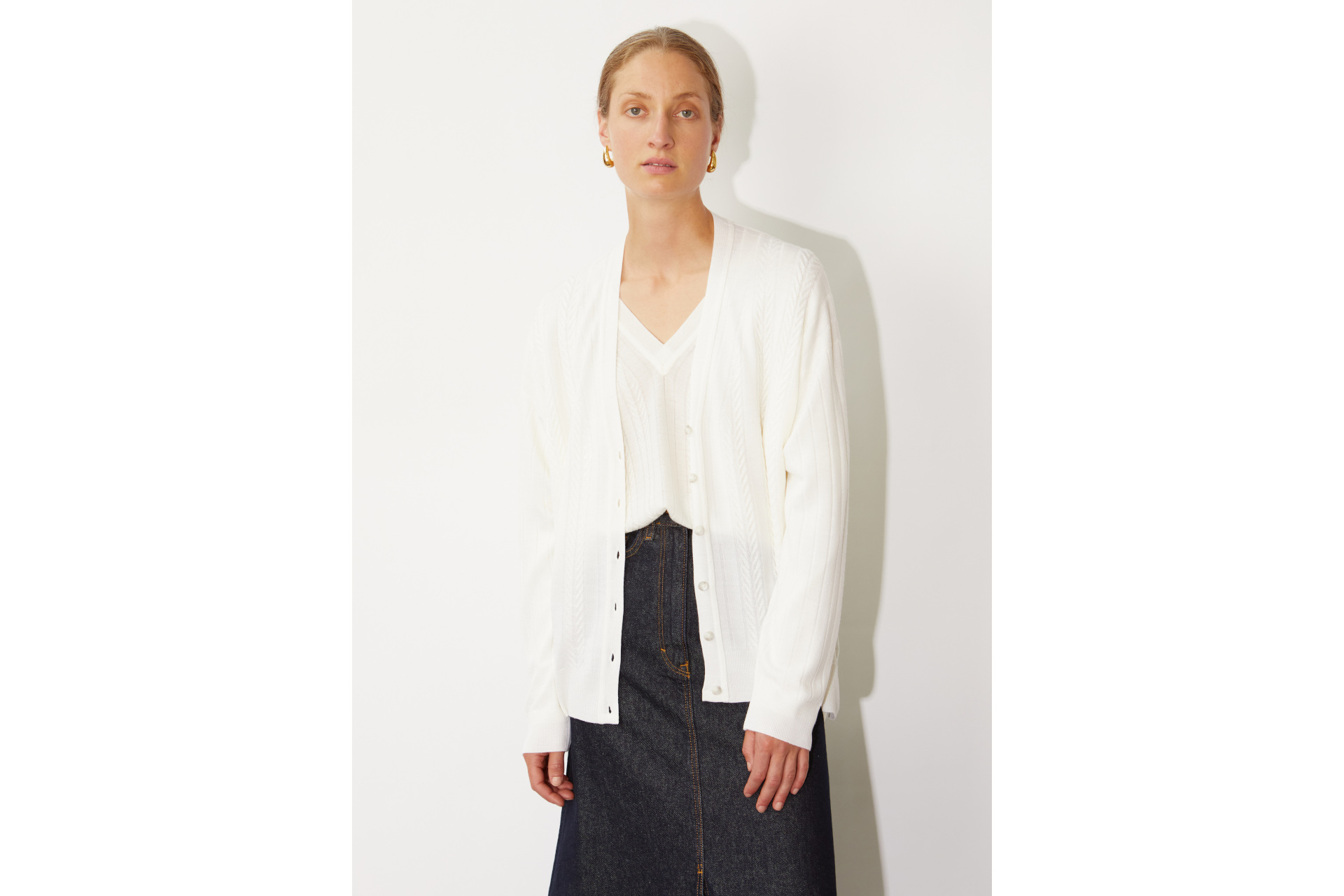 Woman in white cardigan