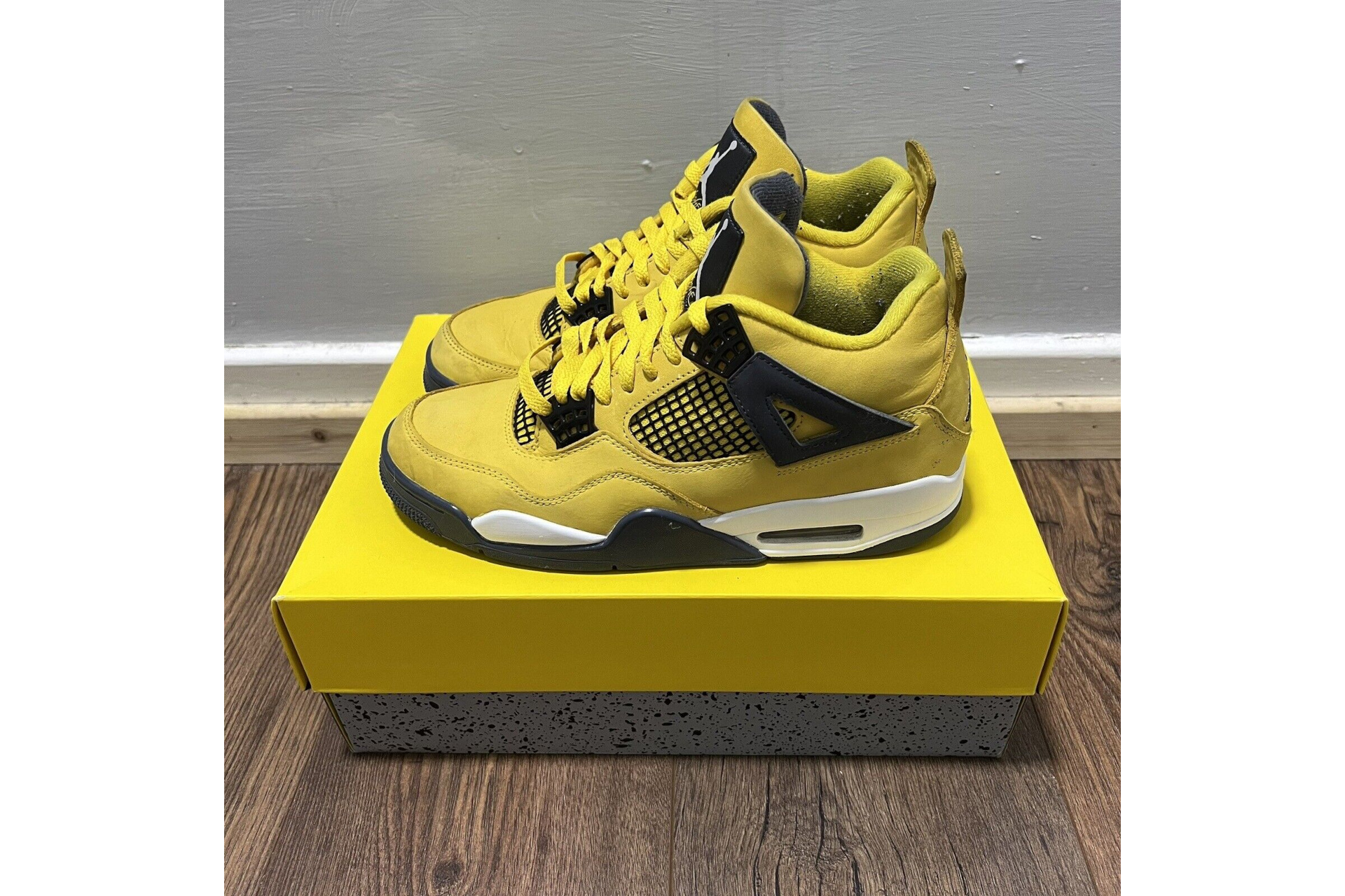 Yellow sneakers on box