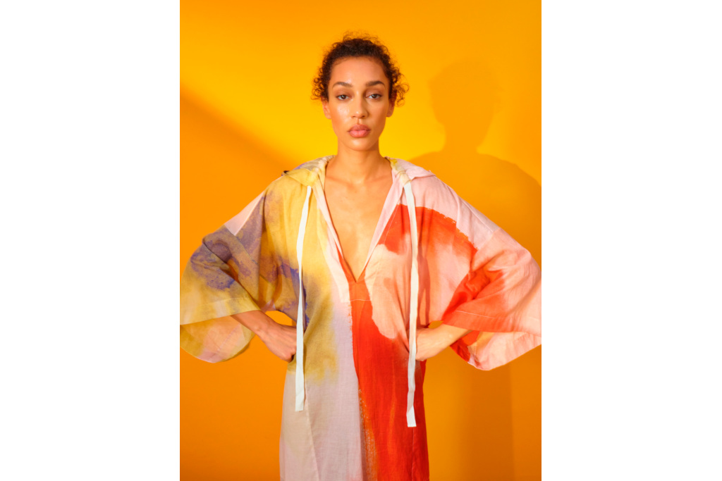 Woman in orange and red caftan