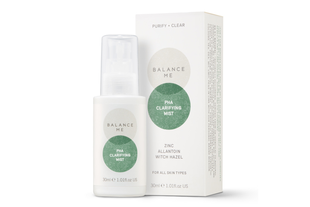 White mist bottle with greencircle design next to matching box