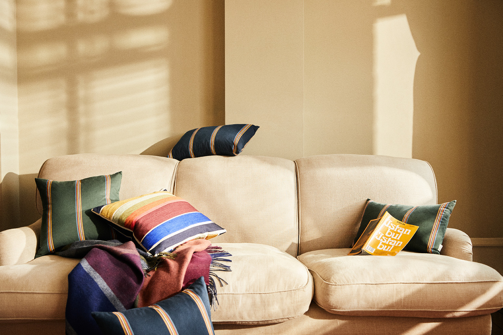 Sofa covered in striped cushions