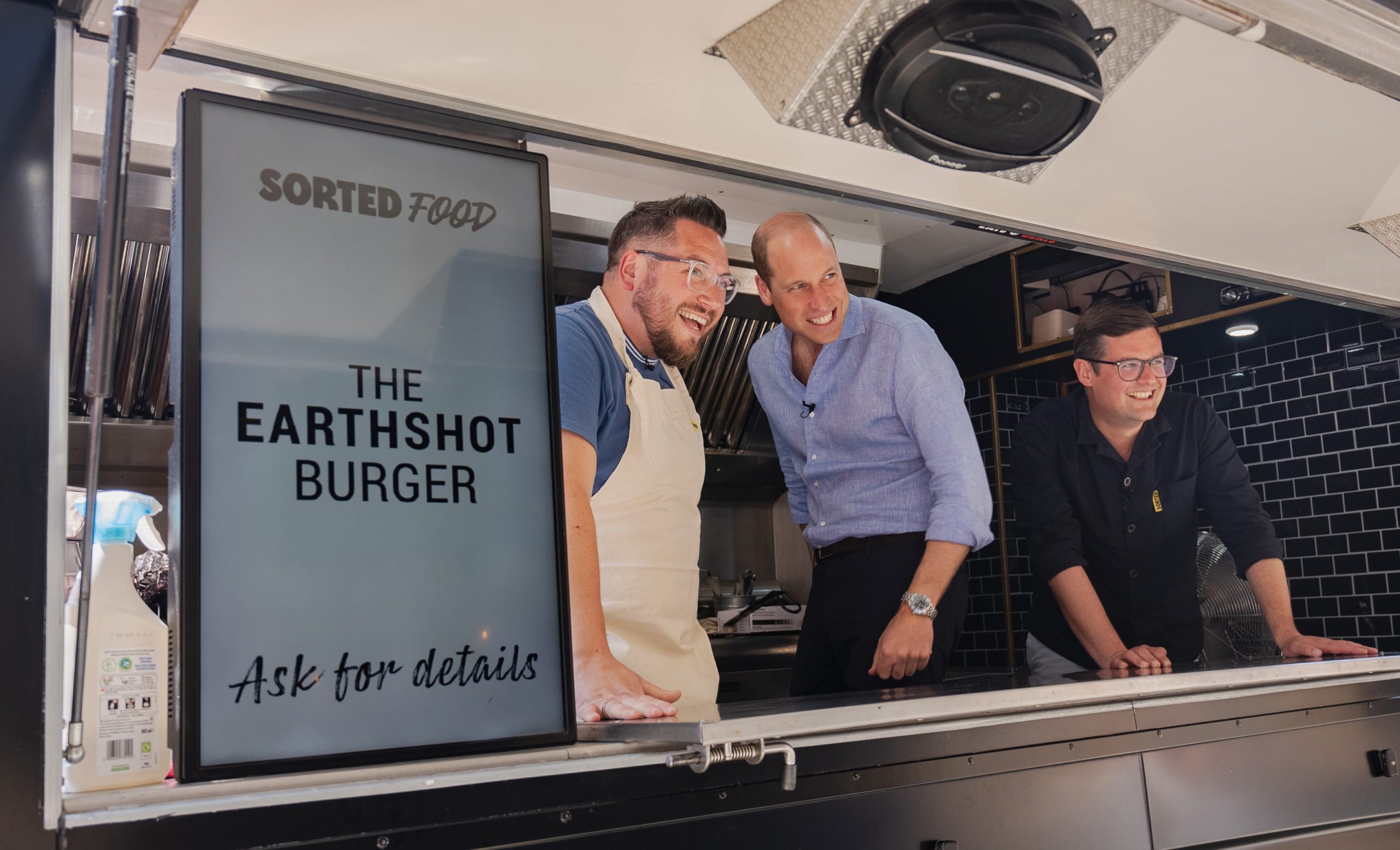 Prince of Wales serving burgers