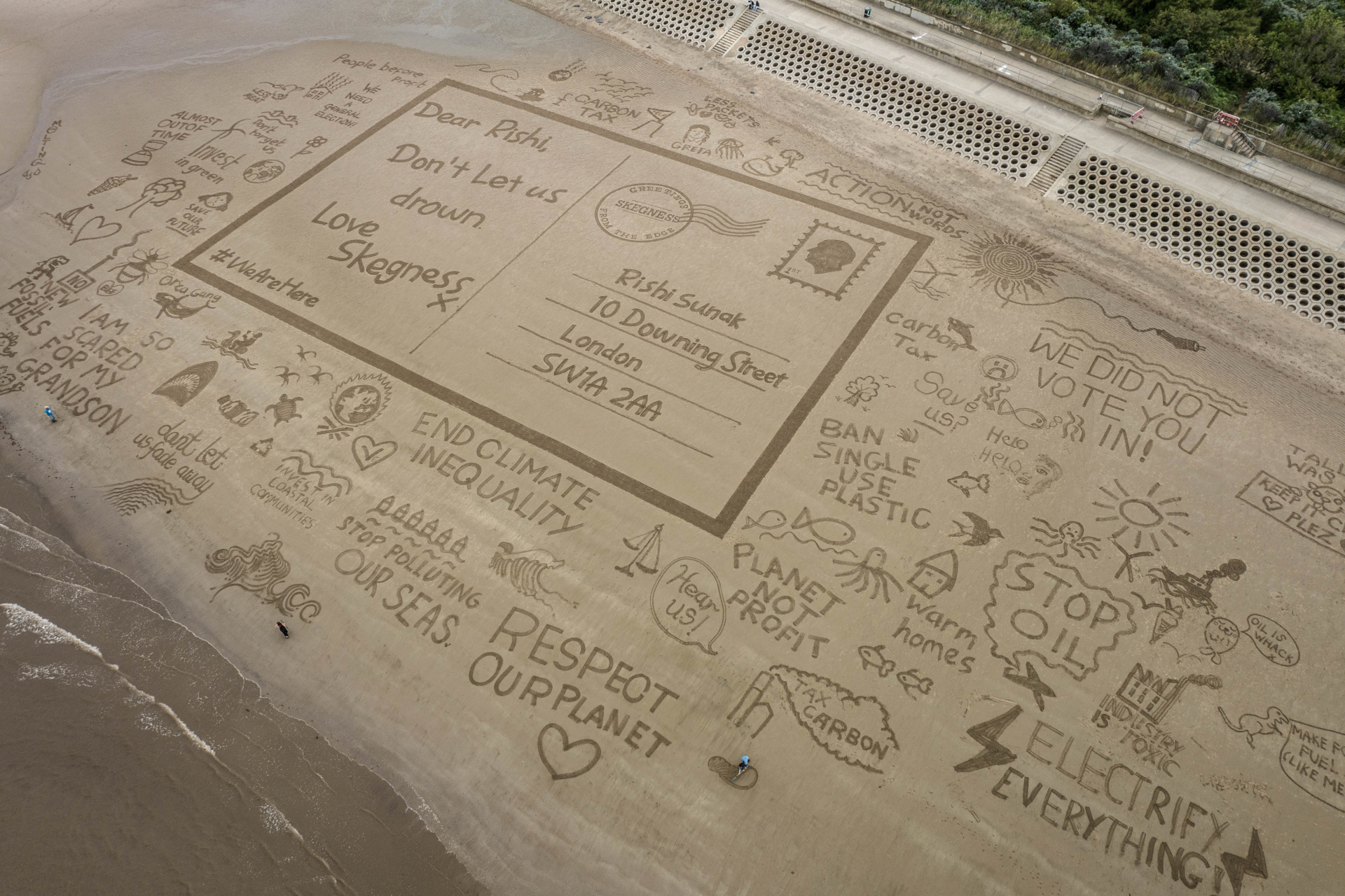 Postcard drawn in the sand