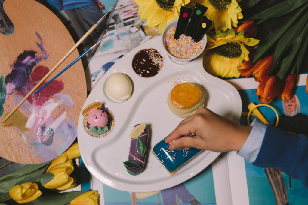 Children decorating cakes at afternoon tea at Rosewood London
