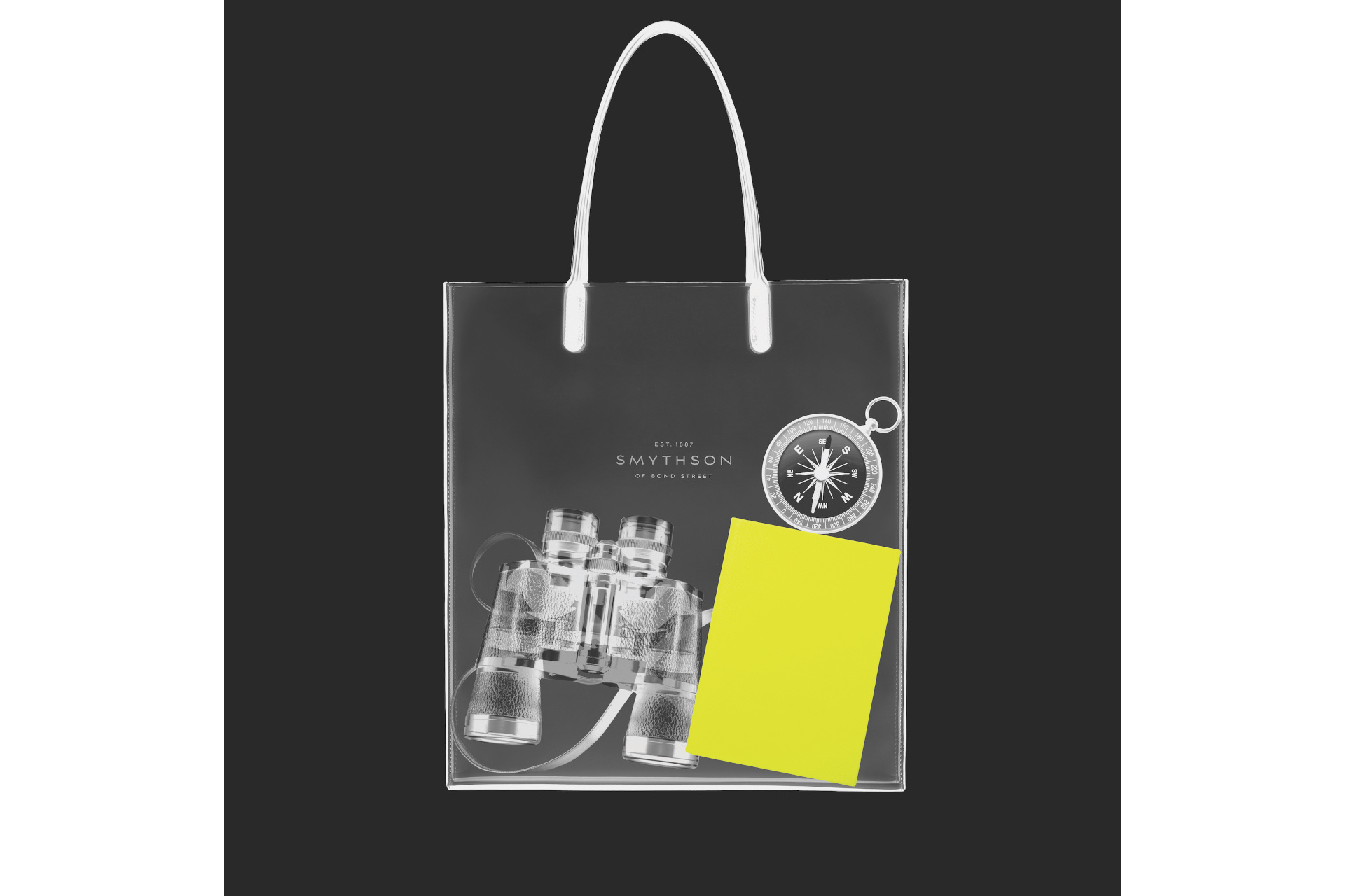 Black xray style image of handbag with yellow notebook inside
