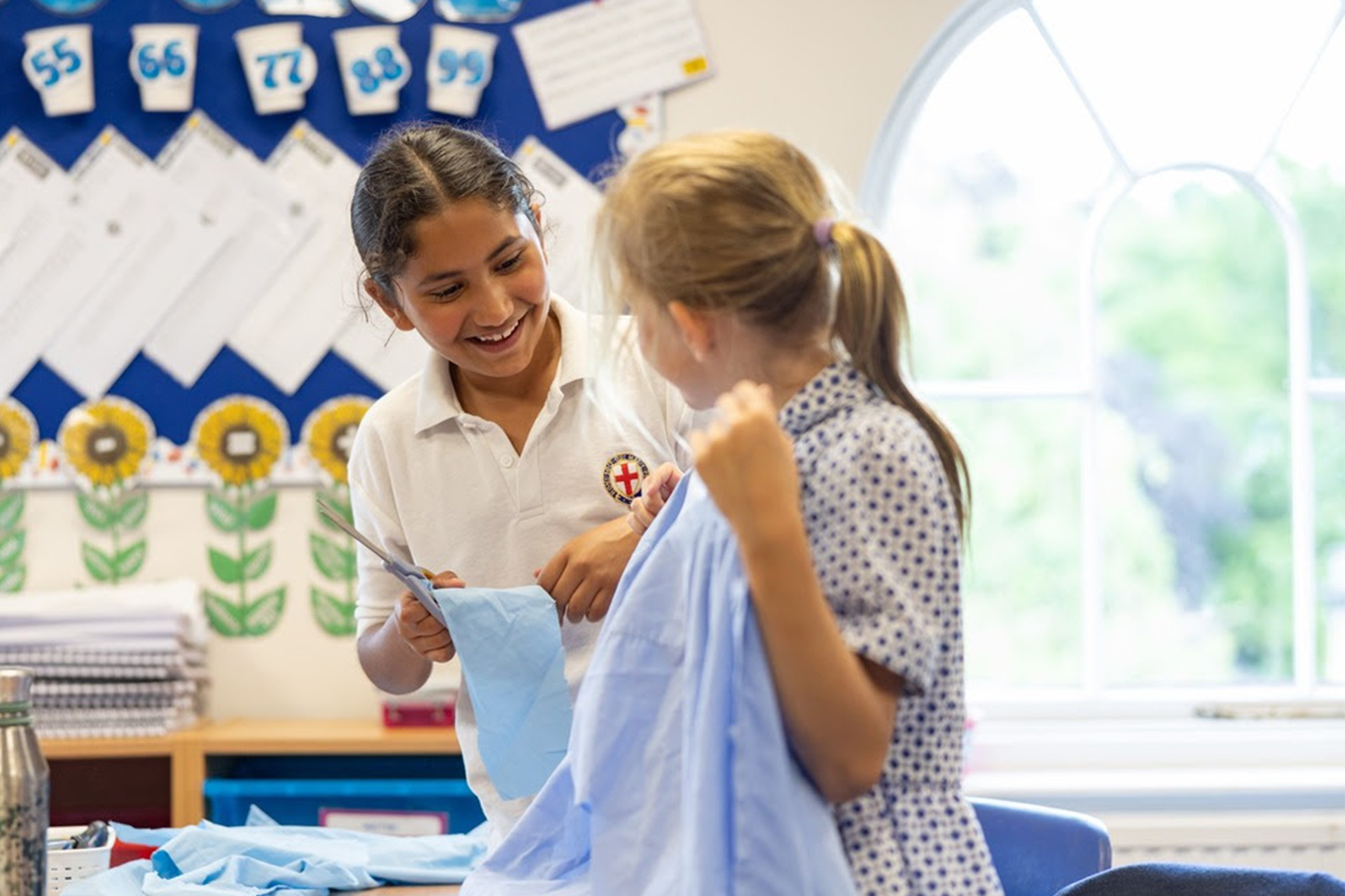 Members of the school's Eco Club cut up old uniform for an upcycling project