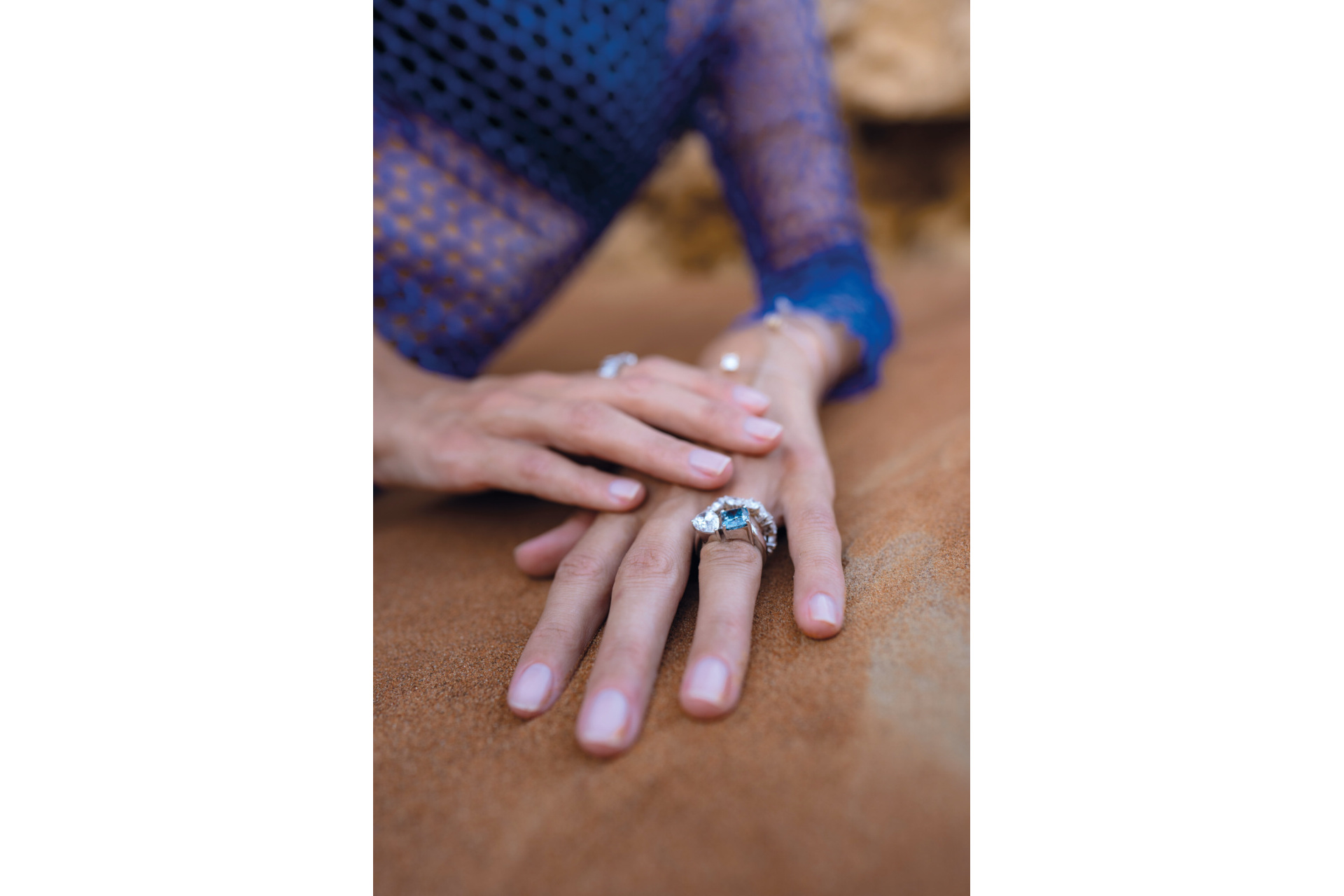 Close up of hand wearing diamond ring