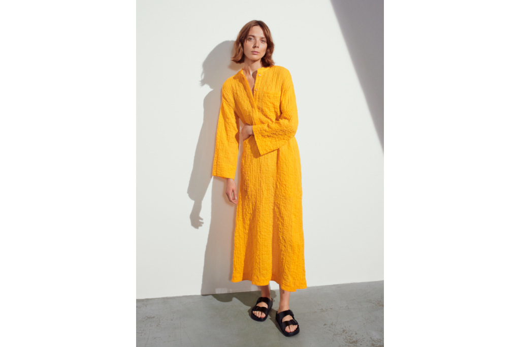 Woman in mustard coloured dress
