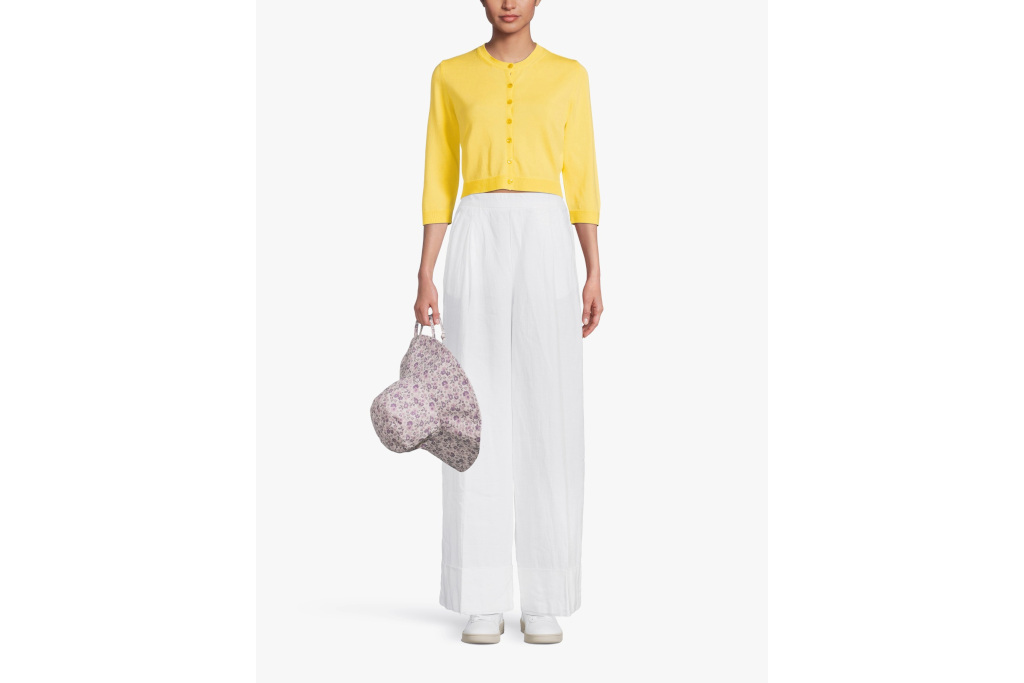 Woman in white trousers and yellow top