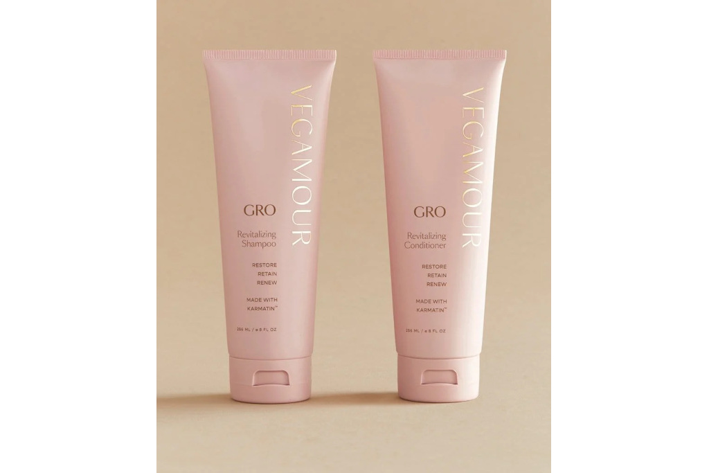 Pink bottles of shampoo and conditioner