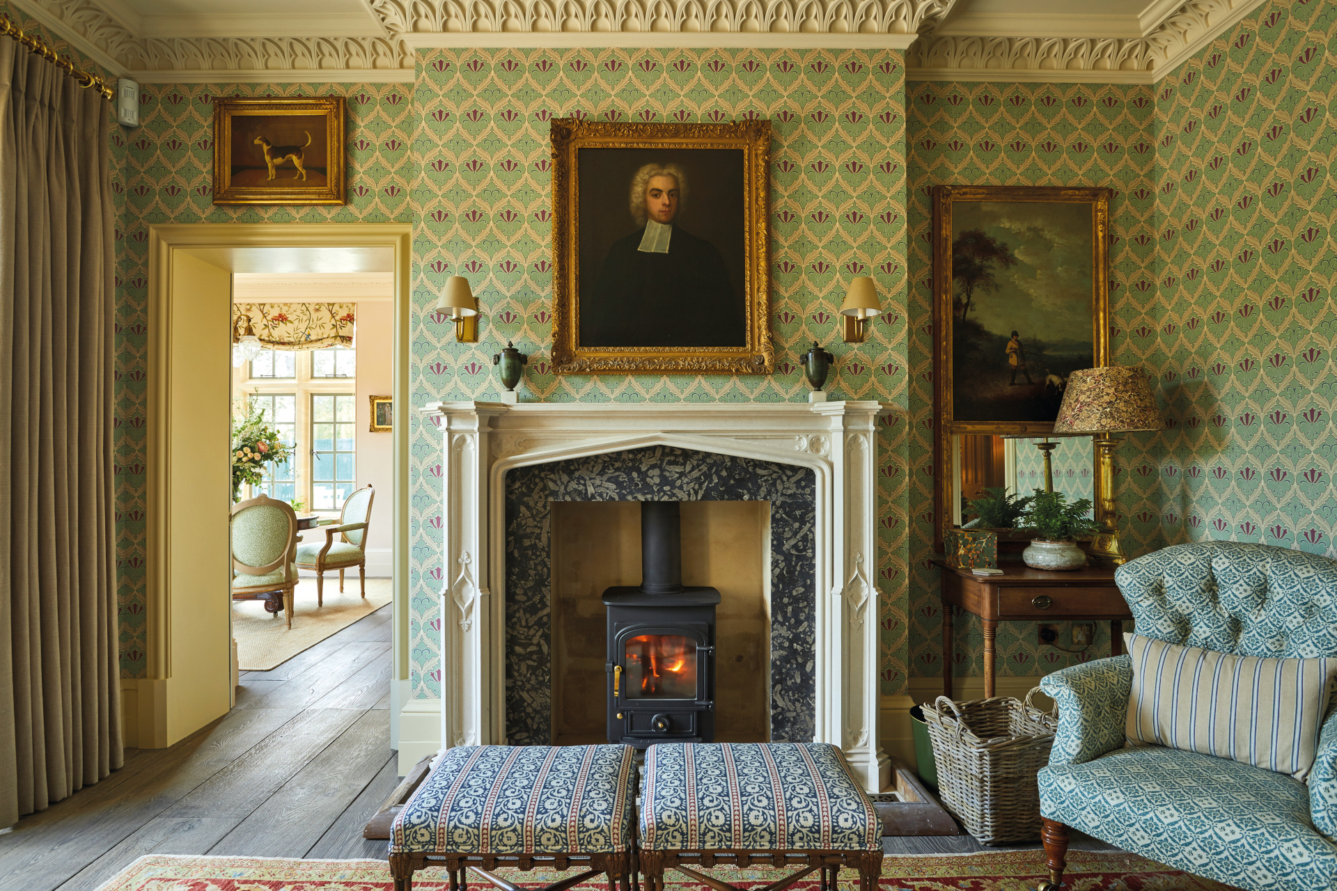 Wallpapered sitting room with country fireplace