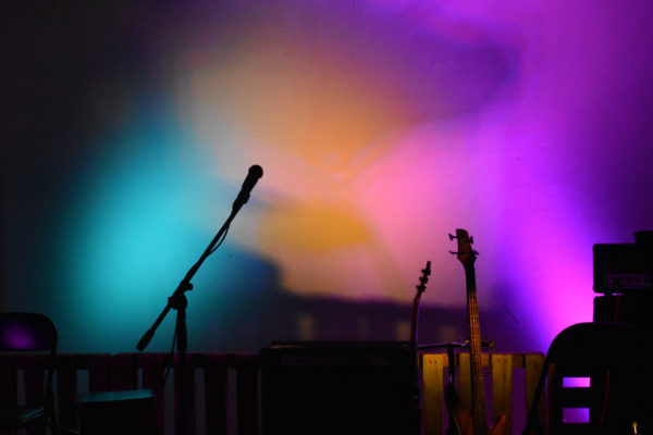 Stage with microphone stand and guitar