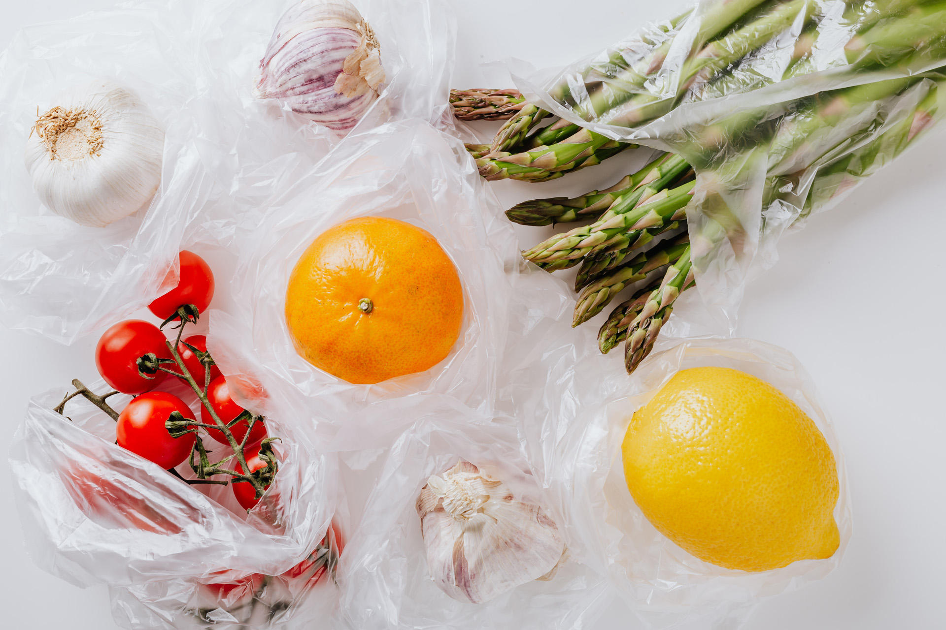Fruits and vegetables in thin plastic bags